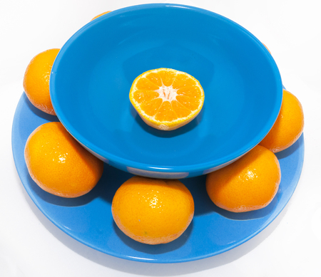 Mandarins on blue plate  Christmas and New Year traditionの写真素材
