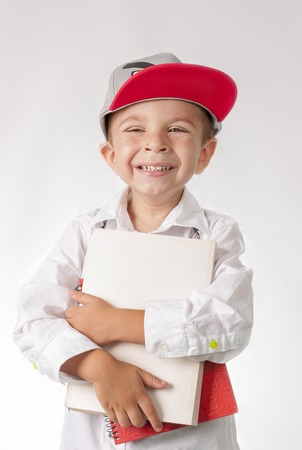 Young boy with books preparing to schoolの写真素材