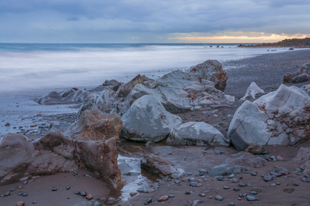 Sunrise on black sand volcanic beach. Tenerifeの写真素材
