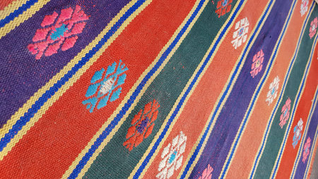 Ornate vintage rug with colorful stripes and folk rhombus pattern. Turkish striped carpet...