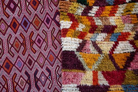 Turkish ornate carpets background. Colorful fluffy carpet with rhombus pattern and weaved rhombus mat. Woven texture. Ethnic pattern rug. Traditional Asian ornaments. Turkish bazaar backdropの写真素材