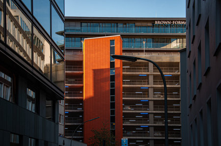 Hamburg / Germany - 09 05 2018: Urban landscape with orange color modern corporate building and...