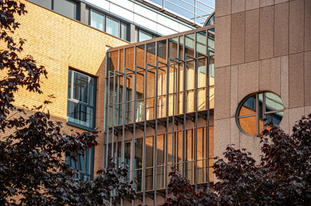 Glass gallery and round window of modern corporate building in Hamburg Germany. Unusual architecture...