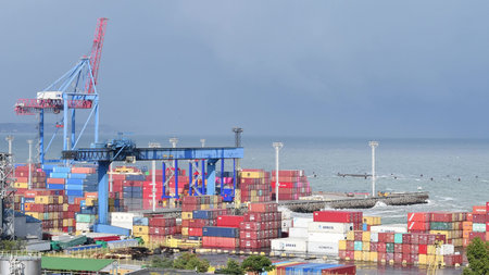 Cargo container terminal at maritime port. Logistic Import Export background. Sunny weather after...
