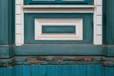 Grunge blue wall background with rough painted texture and relievo rectangle frames. Damaged brick...