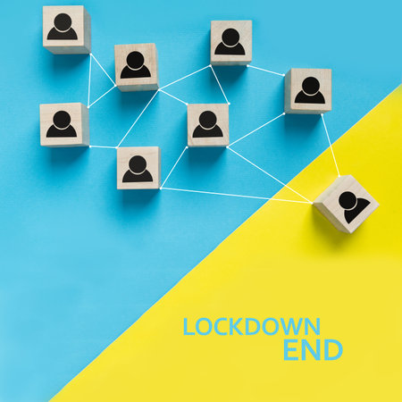 Lockdown end after Covid-19, back to normal life and social contacts. Concept made of wooden...