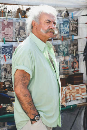 Vienna, Austria - July, 20, 2013: Vienna flea market Naschmarkt. Vintage, 2nd Hand, antiques. About 400 sellers present their goods every Saturday. Vinyl records real authentic salesmanのeditorial素材