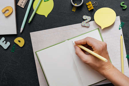 Back to school concept. School and office supplies on office table. Flat lay with copy space. Minimalistic creamy background.の写真素材