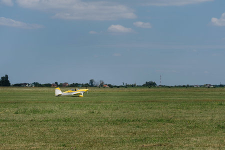 Plane flying in the sky over the airfield. Taking off on the aerodrome. Small aviation extreme sport...