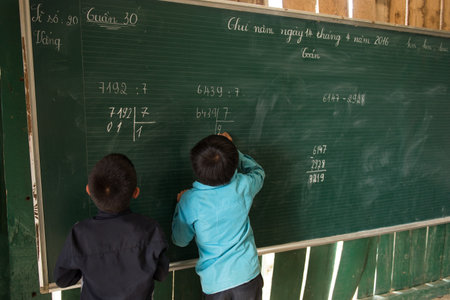 Sapa, Vietnam - April 14, 2016: Vietnamese school children in the classroom. Rural education at the mountains of Vietnam for Hmong minority kids. Poor village educationのeditorial素材