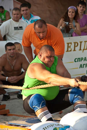 Kiev, Ukraine, 08/13/2017 Strongmen athletes pulling ropeのeditorial素材