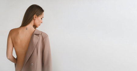 Banner Pretty cheeky Caucasian woman tacking off business jacket. Sensual fashion style body of...
