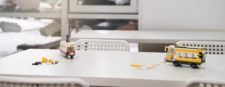 Banner Empty class in school after science lessons. Tables in the room with handmade toys, nobody....