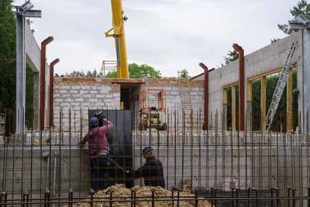 man working at construction site building private house and reinforced concrete structures of the...