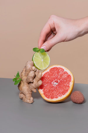 Balancing ginger, sliced lime, grapefruit, lychee. Immune boosting citrus fruits for supply of...