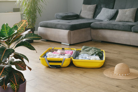 Packing travel suitcase at home. Getting ready for a trip, no people. getting ready to travel trip conceptの写真素材