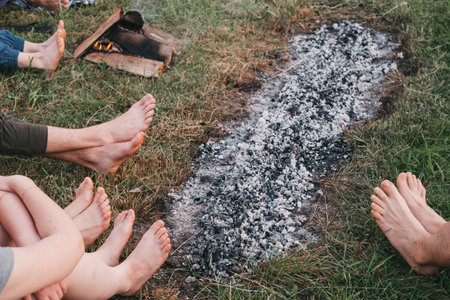 Coal walking or fire walking. Barefoot person on burned wood and hot embers. Training willpower and strength for healing. initiation and faithの写真素材