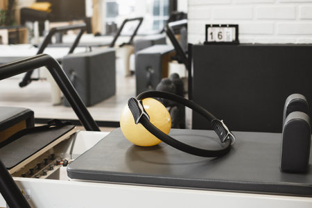 Equipment for pilates on reformers. No people. Empty gym space for training and sport activitiesの写真素材