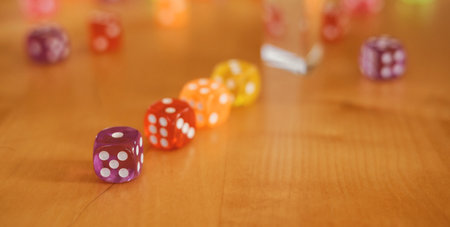 Dice spilling out on wooden table background. Closeup, Table gameの写真素材