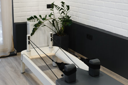 Equipment for pilates on reformers. No people. Empty gym space for training and sport activitiesの写真素材