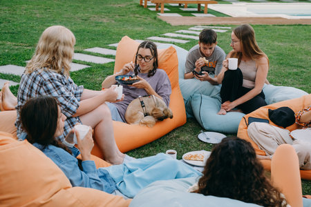 Friends casual outdoor dining lifestyle, sharing foodの写真素材