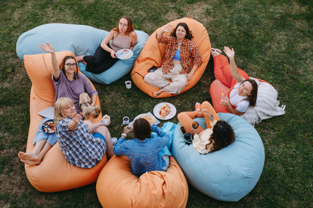 Friends casual outdoor dining lifestyle, sharing foodの写真素材