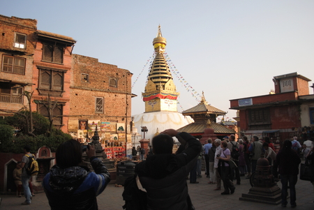 The Swayambhunath in Nepal-November 10,2012 Traveller take a photo to The eyes Stupaのeditorial素材