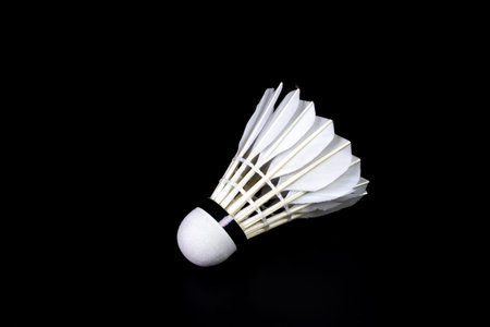 White Shuttlecock isolated on black background.