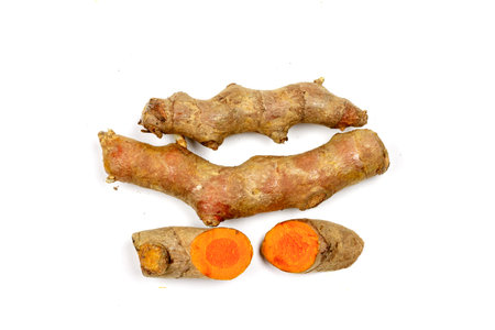 Close up Cutting of turmeric roots isolated on white background