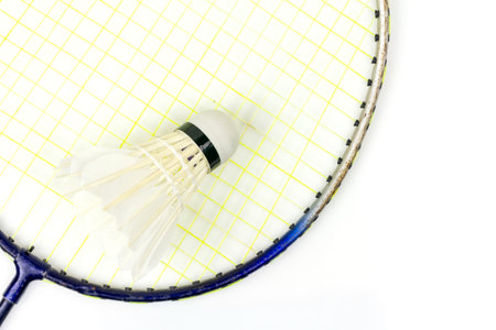 Top view badminton racket and shuttlecock isolated on white background.