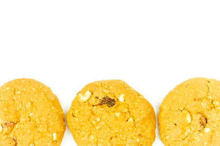 Oatmeal raisin cookies isolated on white background, top view.の写真素材