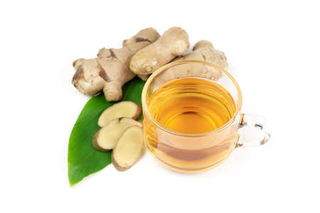 Ginger tea and fresh ginger and sliced isolated on white background. The scientific name is zingiber officinale. Herbs for health care concept.の写真素材