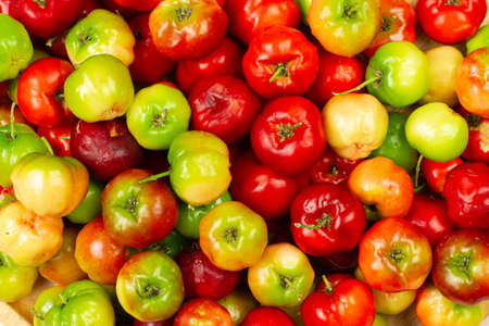 Pile of Acerola Cherry or Barbados Cherry background, top view.の写真素材