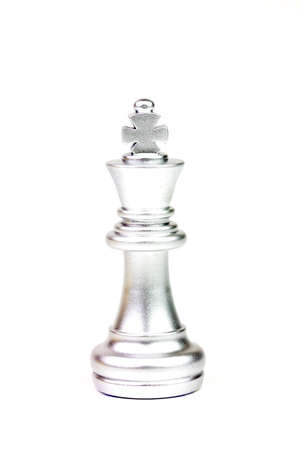 Silver king chess figure isolated on white background. Chess is a game of war to fight with strategy between two players.の写真素材