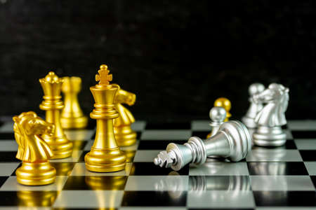 Chess game on chessboard black background. Chess game use for management, marketing and business concepts.の写真素材
