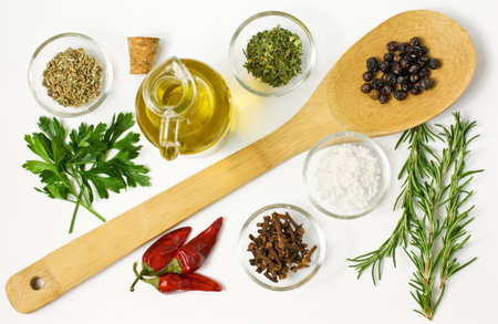 Different spices  and on the table on whiteの写真素材