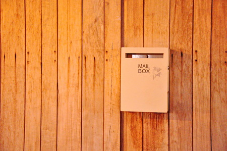 Mailbox on a wooden doorの写真素材