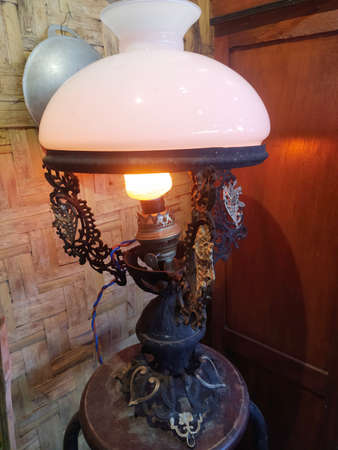 Close up vintage unique lamp with wood pattern backgroundの写真素材