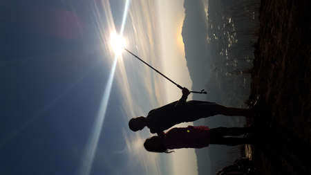 Silhouette of a man on the background of the sunの写真素材