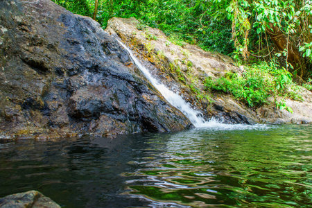 Sarika Waterfall, Khao Yai National Park - Nakhon Nayok Province, Thailand. Green water in...