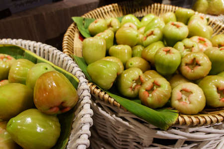 Stack of many rose apple in the market. For food, fruit, kitchen, texture, background and vegetables.の写真素材