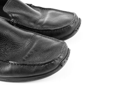 Black leather shoes isolated on white background with copy space.の写真素材