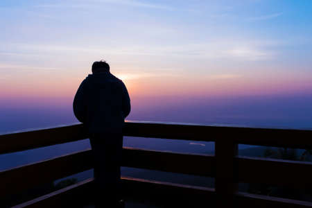 Alone man at the sunset timeの写真素材