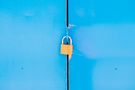 Blue door with lockの写真素材