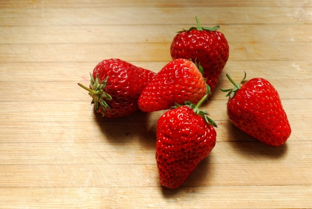 Strawberry on a chopping boardの写真素材
