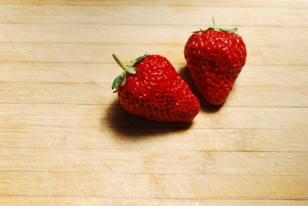 Strawberry on a chopping boardの写真素材