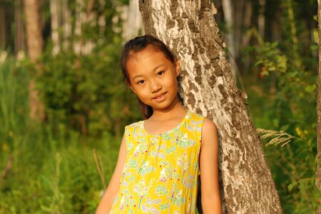 Asian little girl at outdoors.の写真素材