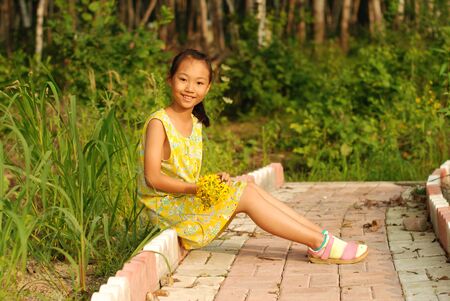Little Asian girl at outdoorの写真素材