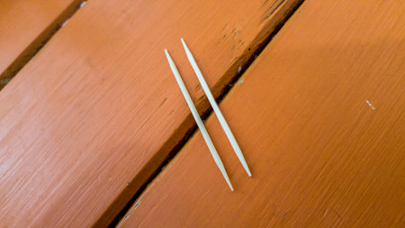 two toothpicks look like bridge or unequal mark.