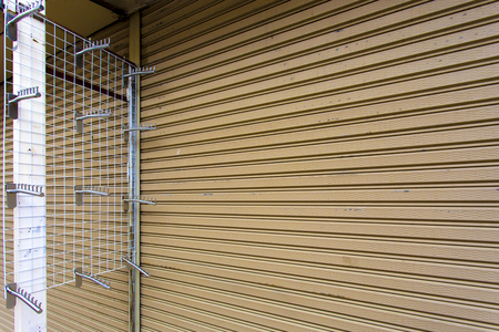 Wall Mounted Clothes Hanger Rack for shirt shop on weekend market. wall, shop, sale, hanging, hangers, design, color, style, fashion, vintage, outdoor, material, market, clothes, stack, store, retail.の写真素材